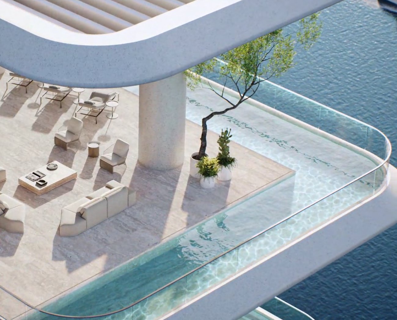Private terrace with lounge seating wrapped by a glass-edged corner pool